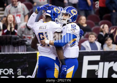 CLEVELAND, OH - APRIL 08: Tampa Bay Storm QB Randy Hippeard (12) scrambles  during the third quarter of the Arena League Football game between the Tampa  Bay Storm and Cleveland Gladiators on