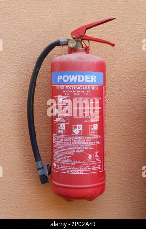 Dubai, United Arab Emirates - February 9, 2022 fire and safety equipment, emergency fire extinguisher usually fixed in kitchen and warehouses, buildin Stock Photo