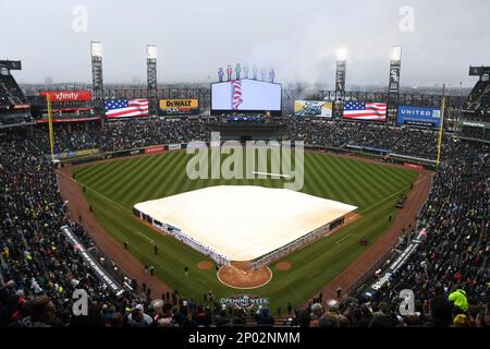 Players for the Chicago White Sox stand for the national anthem before a spring  training baseball game against the Oakland Athletics Friday, April 1, 2022,  in Glendale, Ariz. (AP Photo/Charlie Riedel Stock