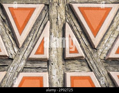 Background image with detail of an ancient wooden facade in medieval Colmar, Alsace, France Stock Photo