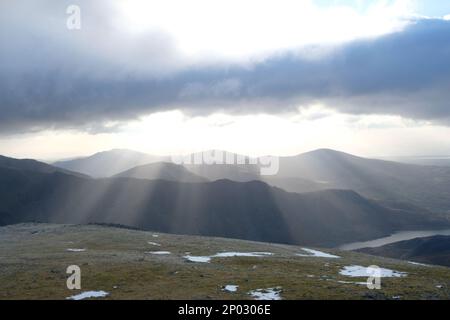 Sunlight breaking through the clouds over Snowdonia National Park Stock Photo