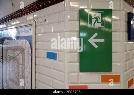 Close-up on an exit sign in the Paris Metro. Stock Photo