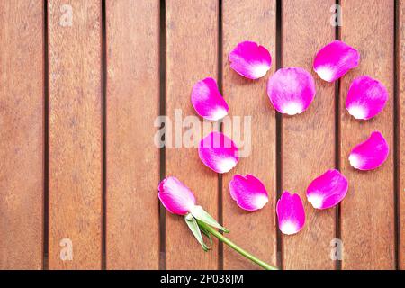Background of pink heart from fresh pink rose petals. Valentines day concept. Copy space. Stock Photo