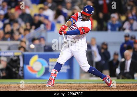 Puerto Rico infielder Francisco Lindor, right, yells after he tagged out  Nicaragua's Juan Diego Montes (99) as Montes tried to steal the second base  during the fourth inning of a World Baseball