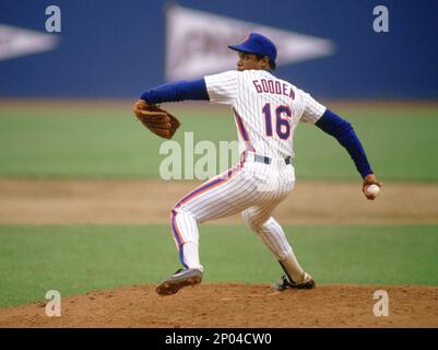 New York Mets Dwight Gooden eyes a pitch before getting a single