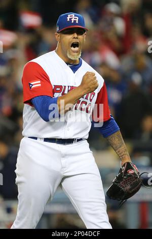 March 20, 2017: Puerto Rico infielder Francisco Lindor #12 and Puerto Rico  infielder Javier Baez #9 confront Netherlands outfielder Wladimir Balentien  #4 after he fave a sign tot he pitcher in the