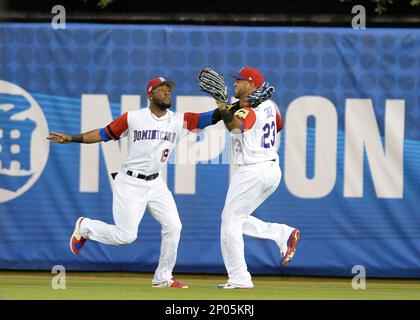 MIAMI, FL - MARCH 11: Dominican Republic outfielder Starling Marte (6) and  Dominican Republic outfielder Nelson Cruz (23) on a fielding error in  center field on a long ball by United States