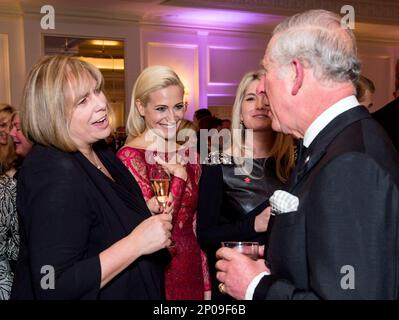Britain's Prince Charles, right, speaks to Pixie Lott, her mother Beverley and sister Charlie-Ann as he attends the annual Prince's Trust 'Invest In Futures' reception at The Savoy Hotel in London, Thursday, Feb. 9, 2017, where he met the charity's ambassadors, supporters and beneficiaries. (Geoff Pugh/Pool Photo via AP)