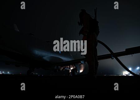 An Air Commando assigned to the 34th Special Operations Squadron, participates in a hot refuel exercise at Hurlburt Field, Fla., Feb. 23, 2023. Hot refuels involve quickly refueling an aircraft while the engine is running, and are usually part of contingency operations like those found in austere environments. (U.S. Air Force photo by Senior Airman Natalie Fiorilli) Stock Photo