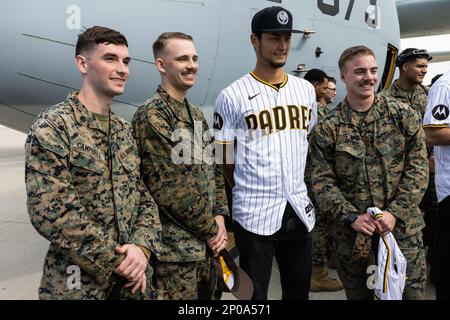 San Diego Padres pitcher Yu Darvish takes a photo with U.S. Marines with Marine Aerial Refueler Transport Squadron (VMGR) 352, Marine Aircraft Group 11, 3rd Marine Aircraft Wing (MAW), on Marine Corps Air Station Miramar, California, Feb. 3, 2023. The Padres players visited to thank the Marines and Sailors for their dedication and service, and to learn about the KC-130J Super Hercules aircraft. Marines with 3rd MAW took the opportunity to shake hands, take photos, and get autographs from the Major League Baseball players. Stock Photo