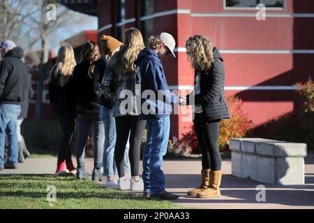 Natalie Goodrich, a member of New Vintage Church, prays with