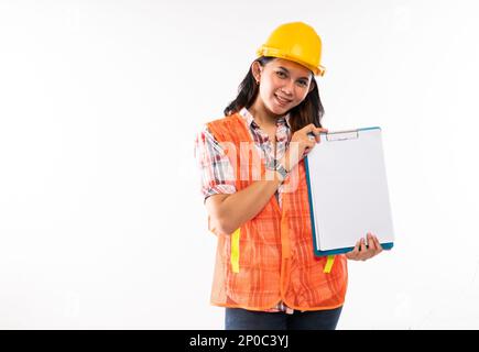a female architect standing and showing the white paper on clipboard Stock Photo