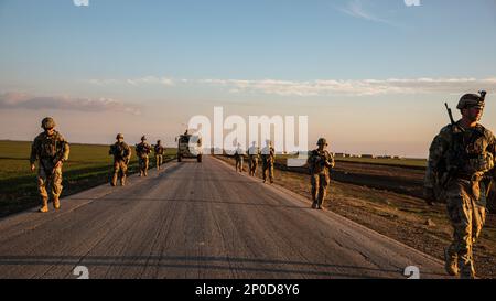 U.S. Army Soldiers, assigned to Bravo Company, 1st Battalion, 118th Infantry Regiment, 37th Infantry Brigade Combat Team, Combined Joint Task Force - Operation Inherent Resolve, during a dismounted patrol, Syria, Feb. 3, 2023. Joint patrols are conducted to share operational knowledge with our partner force to better advise, assist, and enable them in the ongoing efforts to defeat ISIS. Stock Photo