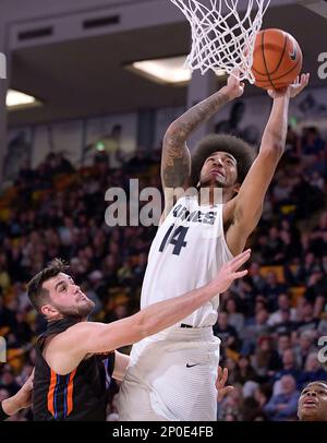 Boise State forward Zach Haney blocks a shot by UNLV guard Kris Clyburn ...