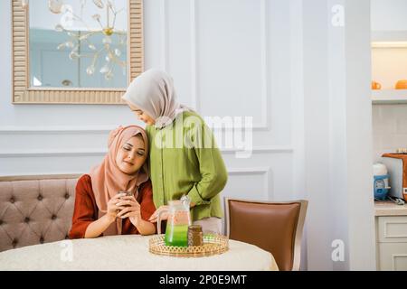 friendship between two Muslim women sympathize when friend is sad Stock Photo
