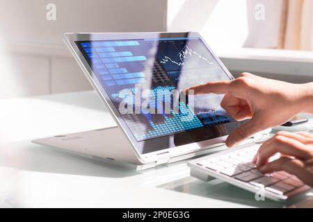 Financial Data Analyst Female Using KPI Dashboard On Laptop Stock Photo