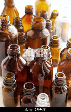 Group of various medical vials background. Many small brown bottles without labels Stock Photo