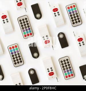 Various types of remote control seamless pattern background isolated on white. Many electronic home appliances controllers Stock Photo