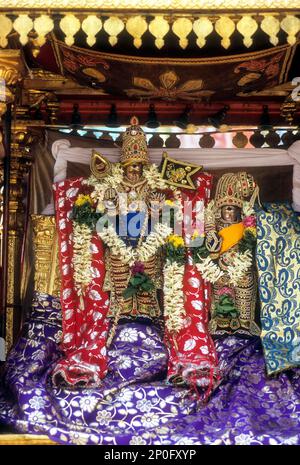 decorated urchava deity lord subramanya and goddess deivanai or devasena in tirupparankundram or thiruparankundram temple near madurai tamil nadu