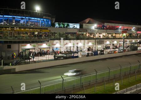 Nuerburgring, race track at night, grandstand with spectators, race cars, racing, night view, Eifel, Rhineland-Palatine, Germany Stock Photo
