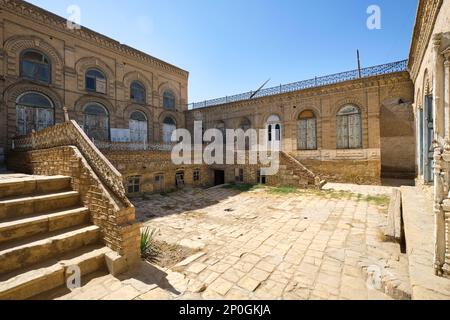 Exterior view of courtyard, brown, tan brick used for facade. At an old, historic, classic, traditional, typical, iconic Jewish house in Bukhara, Uzbe Stock Photo