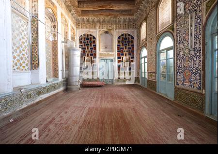 The grand reception, living room with metal, steel heater added. At an old, historic, classic, traditional, typical, iconic Jewish house in Bukhara, U Stock Photo