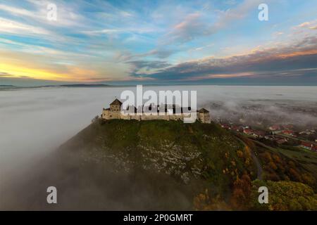 Foggy fall photo about the Fort of Sumeg Hungary. This fort is a Hungarian historical monuments. Medieval fortress. Built by King Bela IV in 13th cent Stock Photo