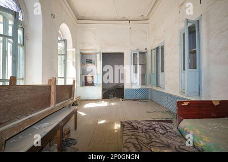 A side room, disused and dirty, abandoned. At an old, historic, classic, traditional, typical, iconic Jewish house in Bukhara, Uzbekistan, Central Asi Stock Photo