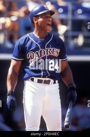 Rickey Henderson points to the crowd after hitting a home run in