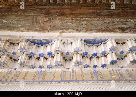 Close up, detail of the fine stalactite, muqarnas painted plaster work. At an old, historic, classic, traditional, typical, iconic Jewish house in Buk Stock Photo