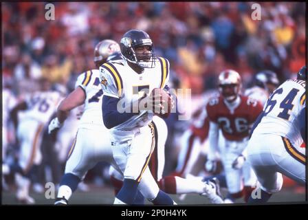 Minnesota Vikings quarterback Randall Cunningham rolls to his