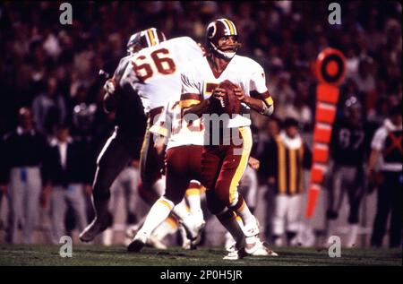 22 Jan 1984: Quarterback Joe Theismann of the Washington Redskins drops  back to pass during the