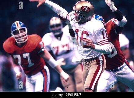 28 Jan 1990: Quarterback Joe Montana of the San Francisco 49ers throws  while pressured during the 49ers 55-10 victory over the Denver Broncos in  Super Bowl XXIV at the Louisiana Superdome in