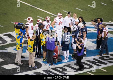 Wisconsin Badgers captains Michael Deiter (63), Leo Musso (19), Dare  Ogunbowale (23) and Vince Biegel (47) watch the coin toss during the NCAA  Big Ten Conference Championship football game against the Penn