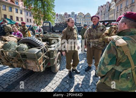 Reenactors, spectators, military vehicles, before reenactment of WW2 battle, City Hall Square in Jelenia Góra, Lower Silesia, Poland Stock Photo