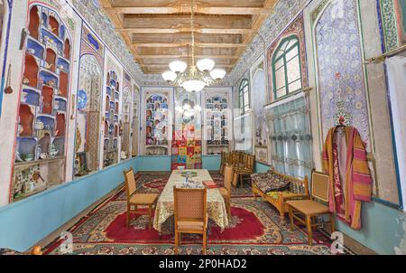 The grand receiving, living room, now used as a dining room. A family currently lives and uses this house. At an old, historic, classic, traditional, Stock Photo