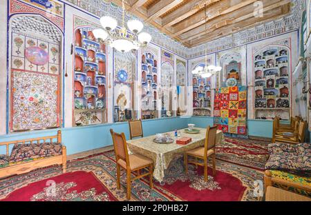 The grand receiving, living room, now used as a dining room. A family currently lives and uses this house. At an old, historic, classic, traditional, Stock Photo