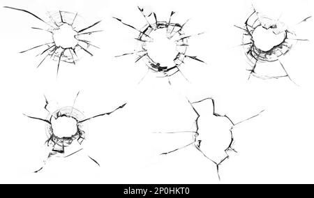 bullet holes and numerous cracks on a plain white glass background, evoking a sense of danger and destruction. The bullet holes are the central focus Stock Photo