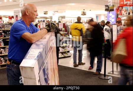 Kohl s employee Dan Loker of Kewaskum watches patrons enter for