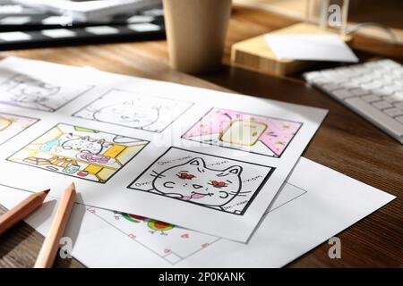 Pre Processing Cartoon Storyboard with cartoon sketches at workplace. Pre-production process ...