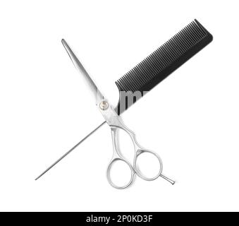 Professional hairdresser scissors and black comb isolated on white, top view. Haircut tools Stock Photo