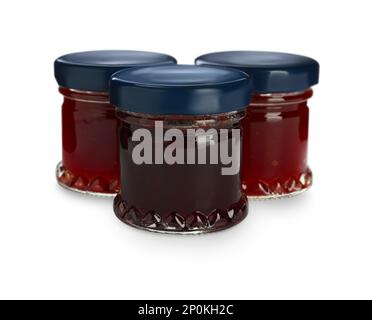 Jars with different jams on white background Stock Photo
