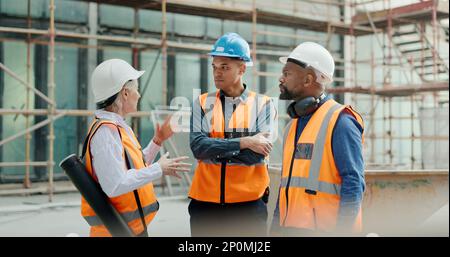 Construction workers, building engineers or tablet in teamwork planning, architecture innovation or property engineering. Smile, happy or talking Stock Photo