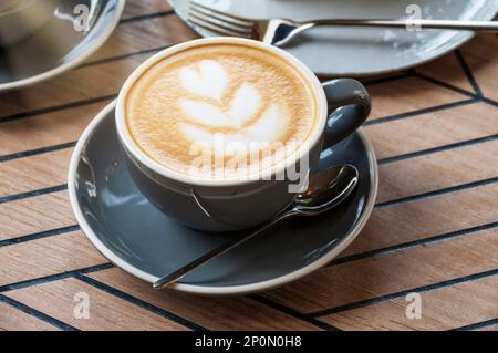 Delicious morning cup of cappuccino in a cafe Stock Photo