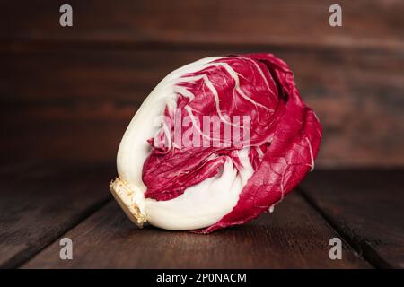 Whole fresh ripe radicchio on wooden table Stock Photo