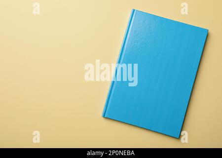 New light blue planner on beige background, top view. Space for text Stock Photo