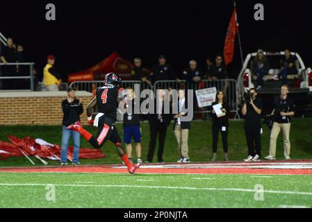 MUNCIE, IN - NOVEMBER 01: Ball State Cardinals Running Back James Gilbert  (34) rushes up the sideline as Western Michigan Broncos Safety Asantay Brown  (6) and Defensive Back Justin Tranquill (2) look