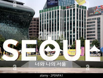 Seoul, South Korea - May 2019:  'I Seoul U' sign with cityscape in background at Seoul City Hall plaza Stock Photo