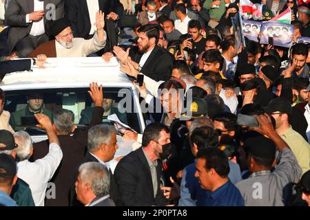 Bushehr, Bushehr, Iran. 2nd Mar, 2023. This handout picture provided by the Iranian presidency shows President EBRAHIM RAISI greeted by crowds in Bushehr, Iran. Stating that the enemy does not want the Iranian nation to live independently, freely, with strong will and cohesion, the President said, The enemy has always tried to stop or at least slow down the Iranian nation's rapid movement with Imposed War, sedition of hypocrites, and malicious threats and sanctions. Still, it has not succeeded and will not succeed. (Credit Image: © Iranian Presidency via ZUMA Press Wire) EDITORIAL USAGE ONLY! Stock Photo