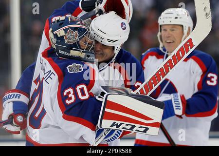 Former Winnipeg Jets Dave Ellett, left, and Dale Hawerchuk take a